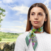 Woman wearing a floral scarf with a scenic background
